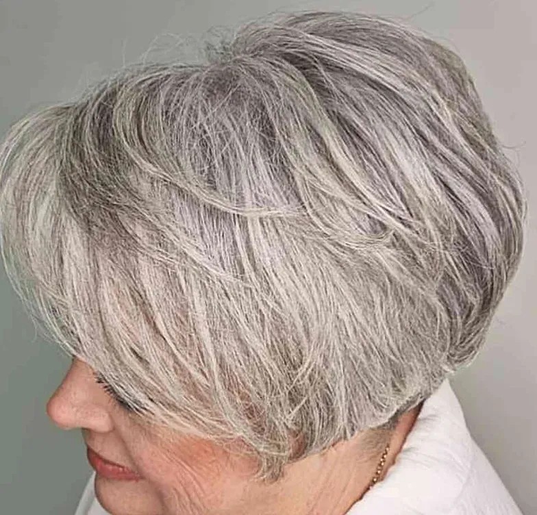 Woman over 70 with a sweeping layered bob — side and back view — short layered haircut back view for women over 70
