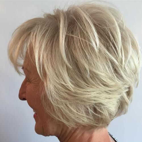 Woman over 70 with a voluminous feathered bob — profile and back — short layered haircut back view for women over 70