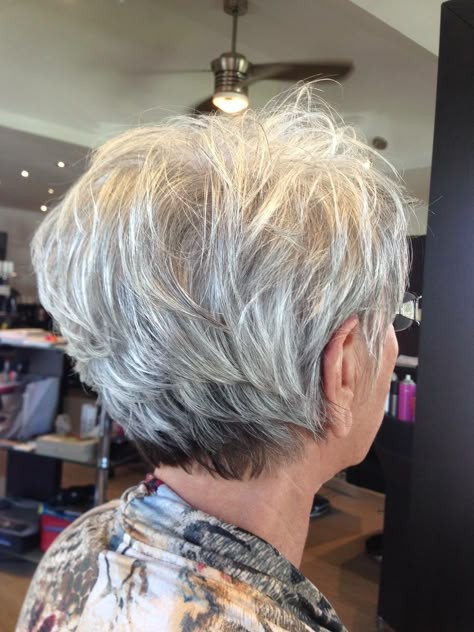 Woman over 70 with a choppy silver pixie — short layered haircut back view for women over 70