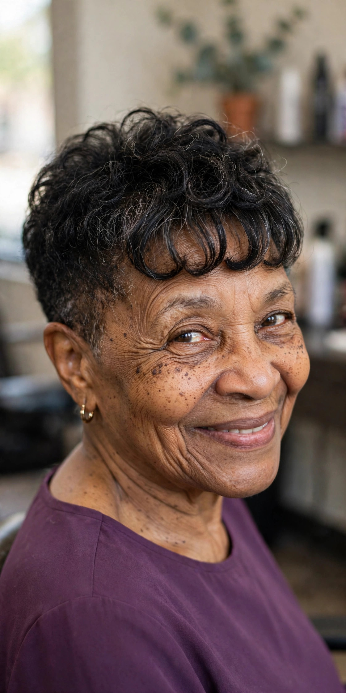 Curly Fringe Taper - short tapered natural haircut on a Black woman over 60