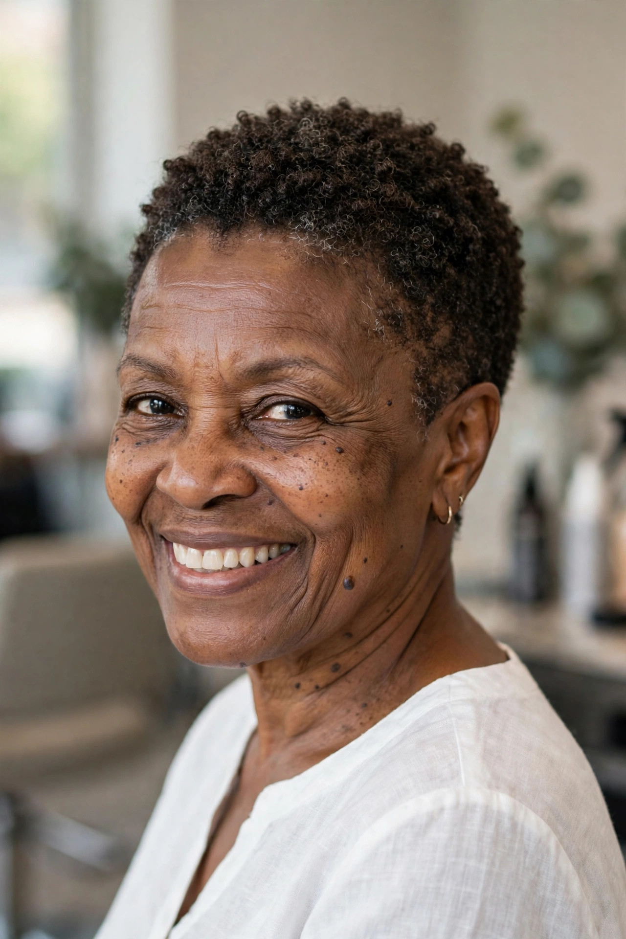 Tapered Pixie-Length Natural Cut - short tapered natural haircut on a Black woman over 60