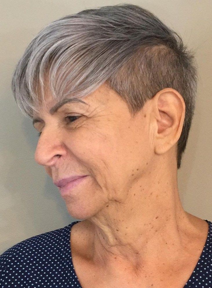 Woman over 70 with undercut pixie with a bold side sweep — flattering bangs hairstyle for women over 70
