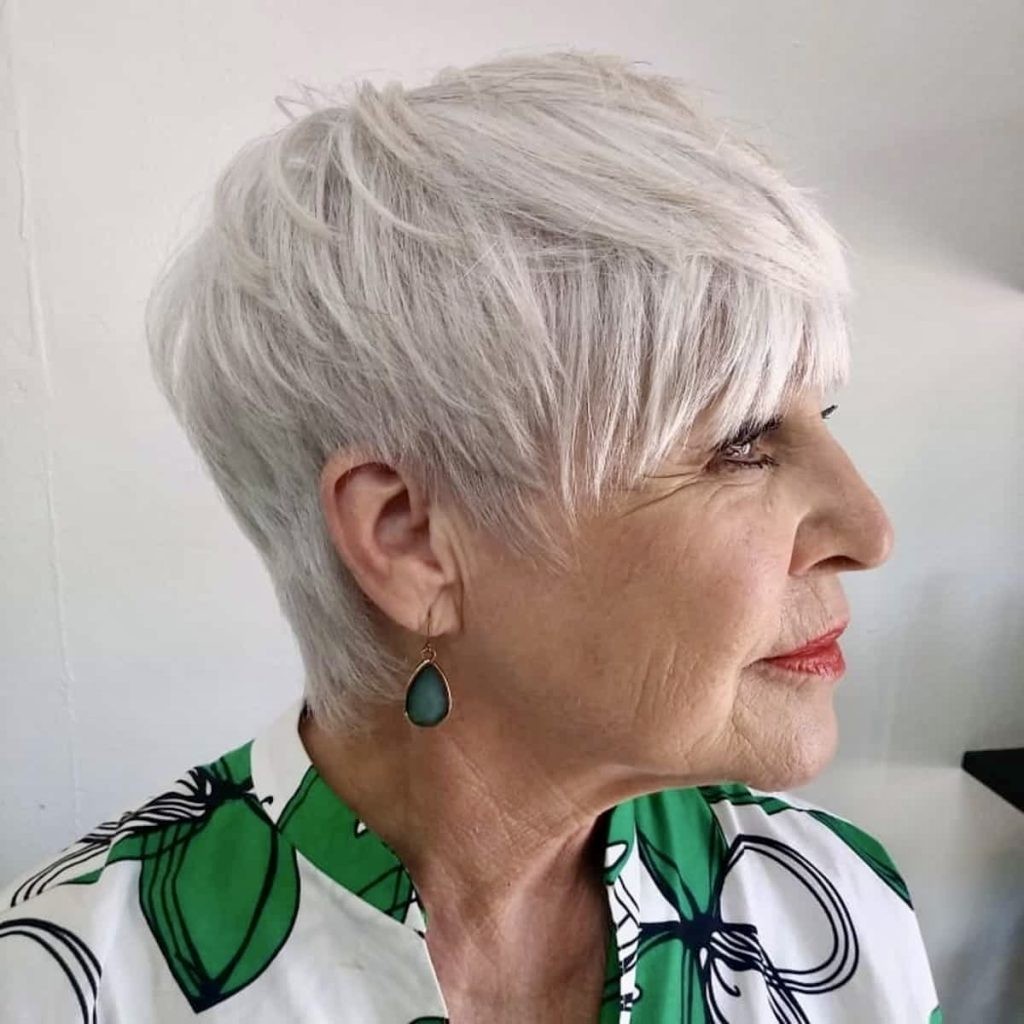 Woman over 70 with pixie with an extra-long side fringe — flattering bangs hairstyle for women over 70