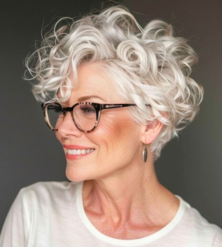 Big Soft Curls With Statement Glasses — soft perm curls on a woman over 70 with flat hair