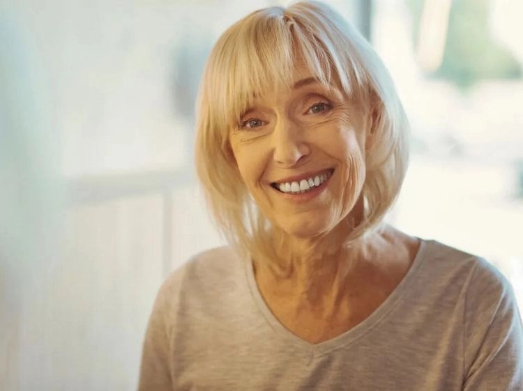 Classic Rounded Silver Bob — soft rounded bob hairstyle on a woman over 70 with gray hair