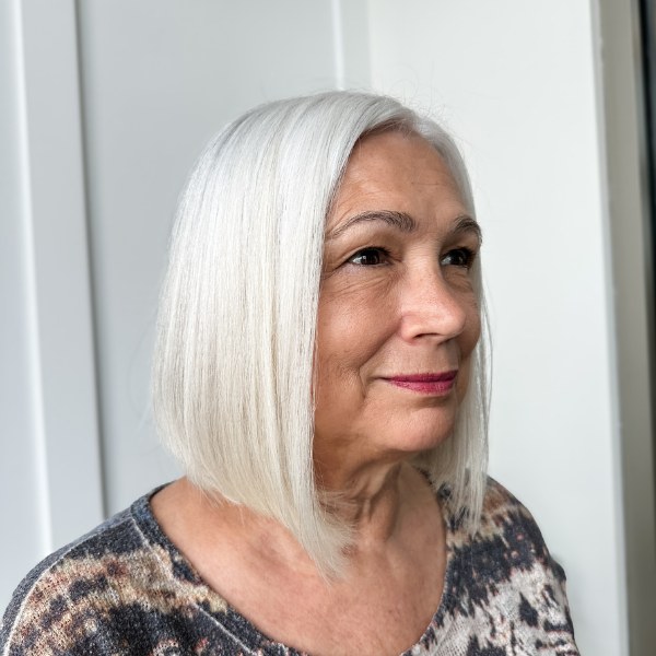 Rounded Bob with a Stacked Rounded Back — soft rounded bob hairstyle on a woman over 70 with gray hair