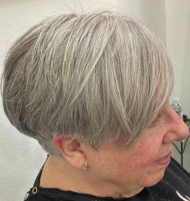 Rounded Bob Styled with a Soft Bend — soft rounded bob hairstyle on a woman over 70 with gray hair