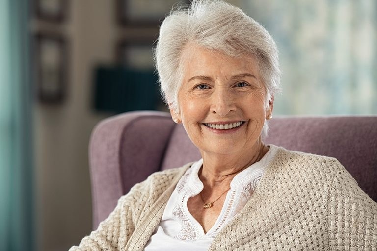 Feathered Rounded Bob for Fine Hair — soft rounded bob hairstyle on a woman over 70 with gray hair
