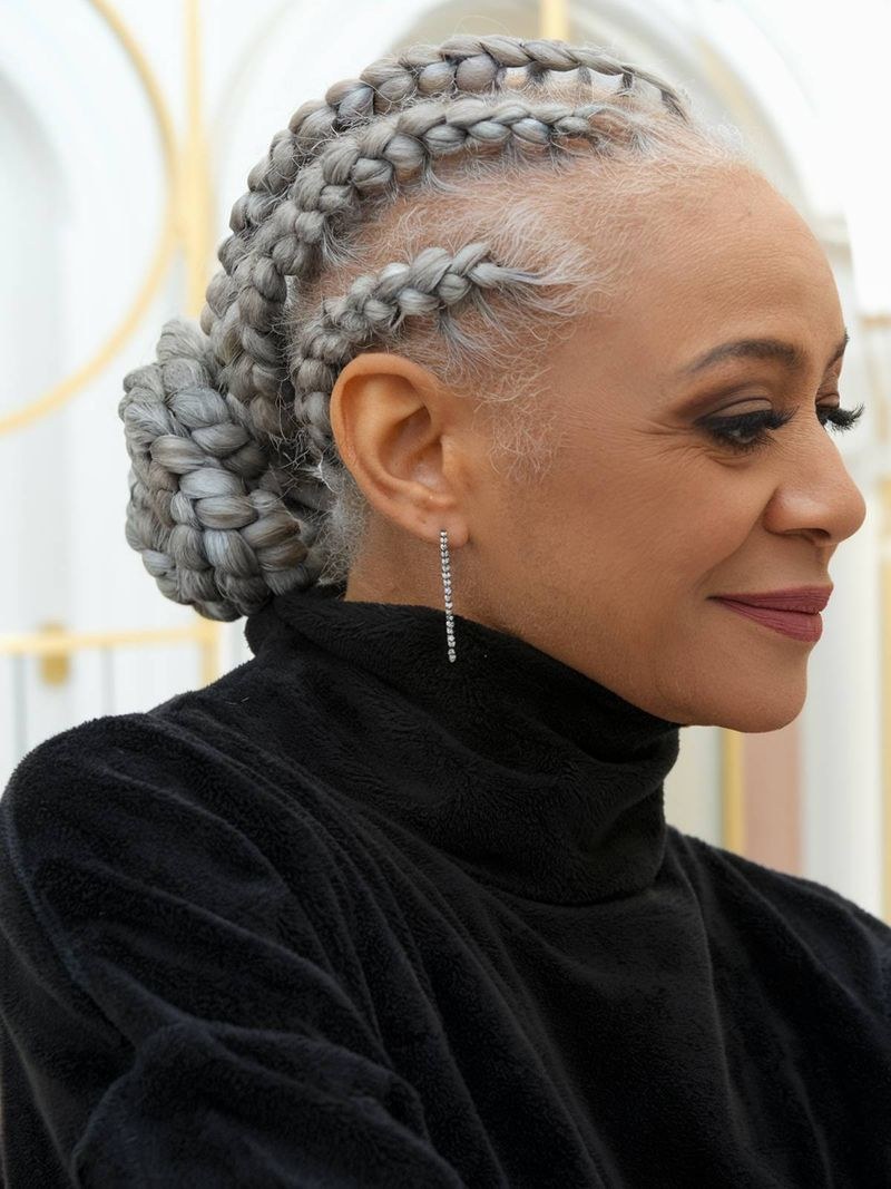 Woman over 70 with gray Braided Bun with Soft Detail — special occasion hairstyle for women over 70