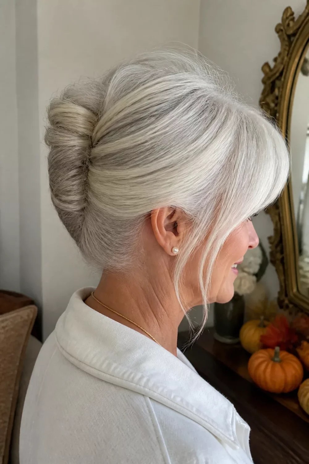 Woman over 70 with snow-White Bun with a Soft Fringe — special occasion hairstyle for women over 70