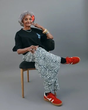 Red Sneakers, Patterned Pants, and a Silver Crop — stylish haircut on a fashion-loving woman over 70