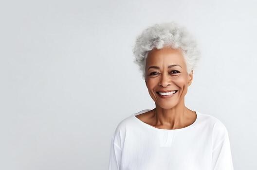Short White Afro With a Simple White Top — stylish haircut on a fashion-loving woman over 70
