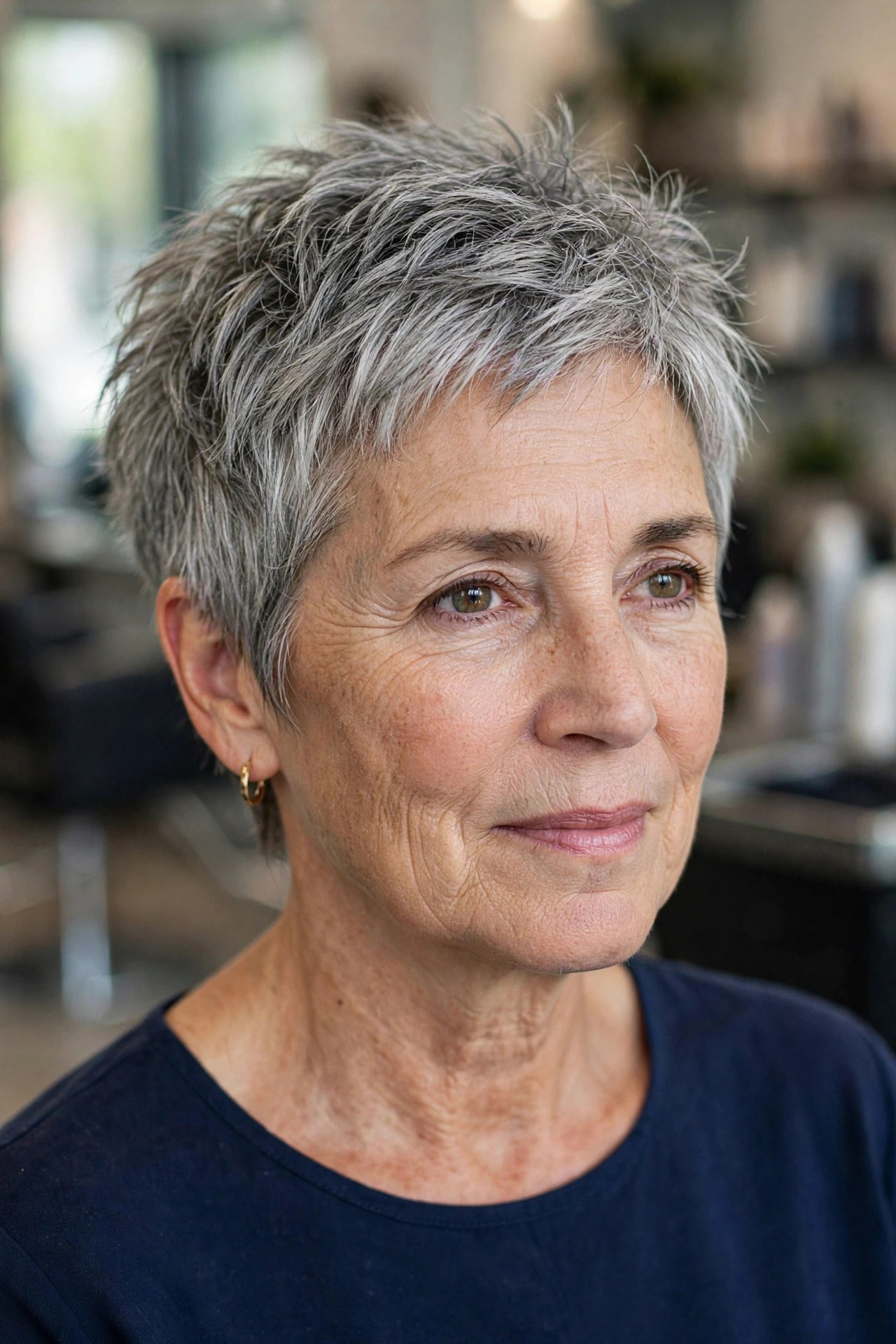 Textured pixie cut with piecey crown on a silver-haired woman over 50, air dried
