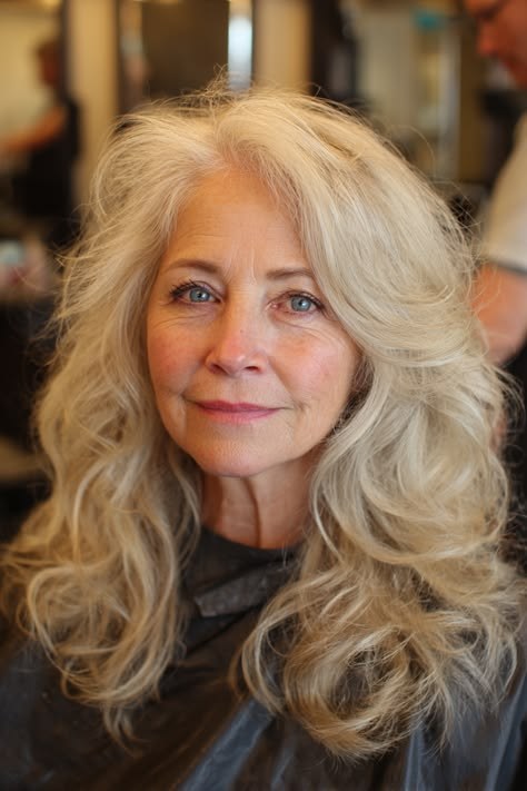 Long Honey-Blonde Waves, Softly Layered — wavy hairstyle on a woman over 70, soft and natural