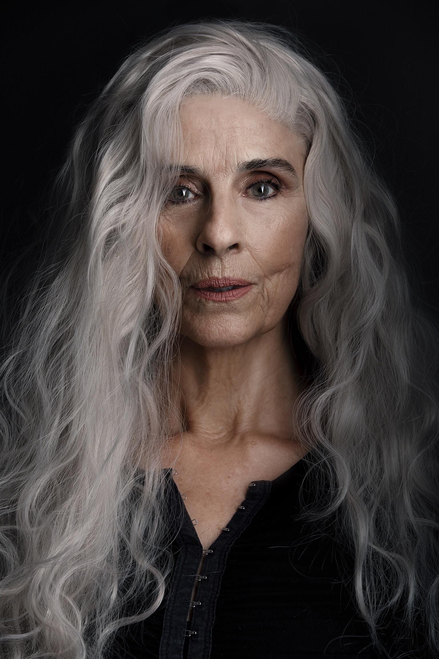 Long Smoky-Gray Waves With Drama — wavy hairstyle on a woman over 70, soft and natural
