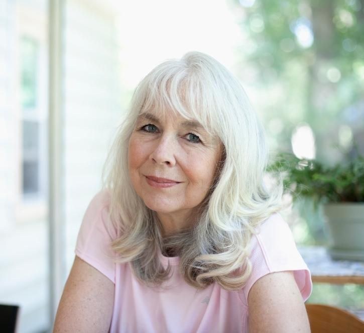 Long Wavy Hair With Soft Bangs — wavy hairstyle on a woman over 70, soft and natural